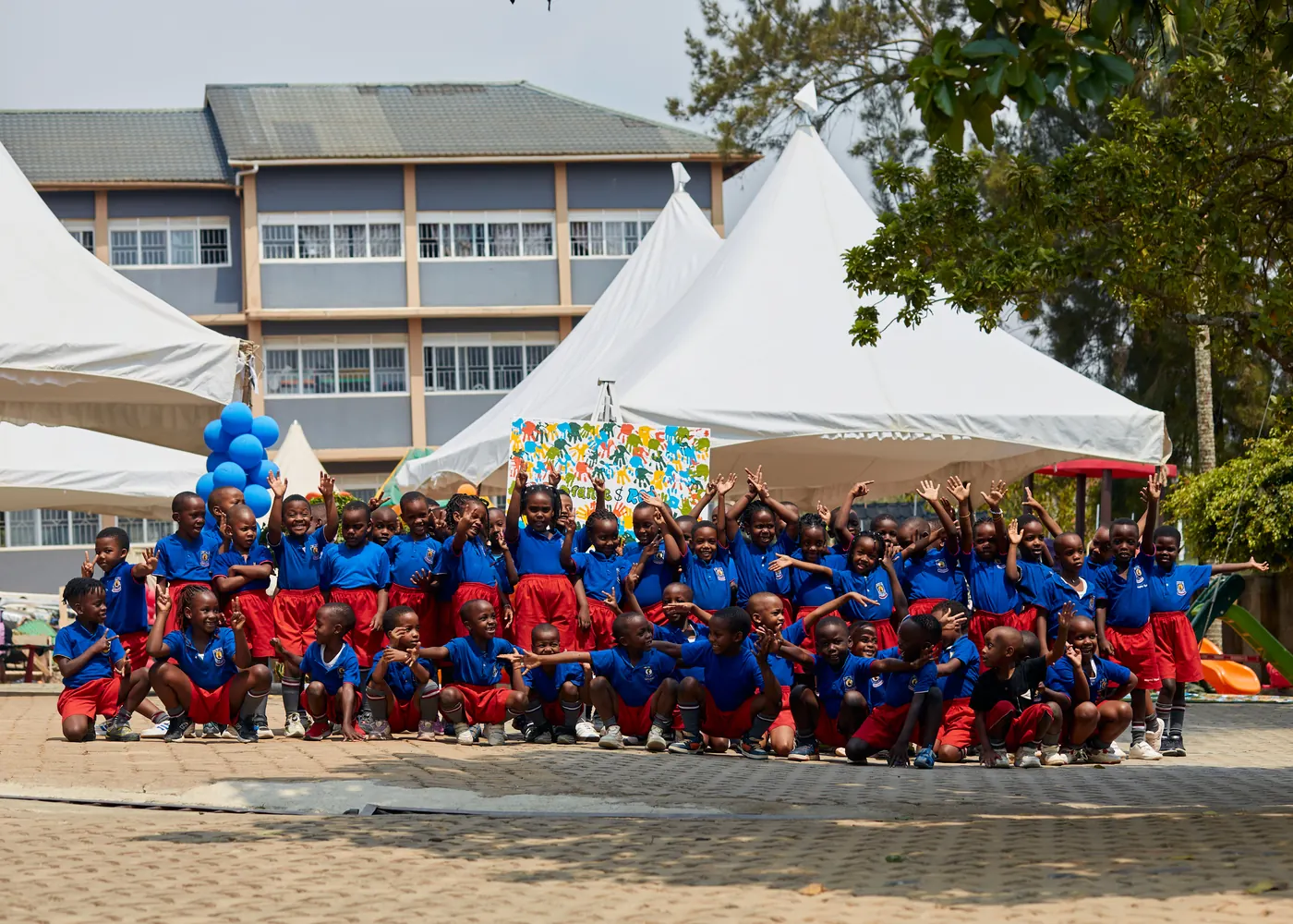 Pupils gathered in front of the Mbarara Preparatory School building