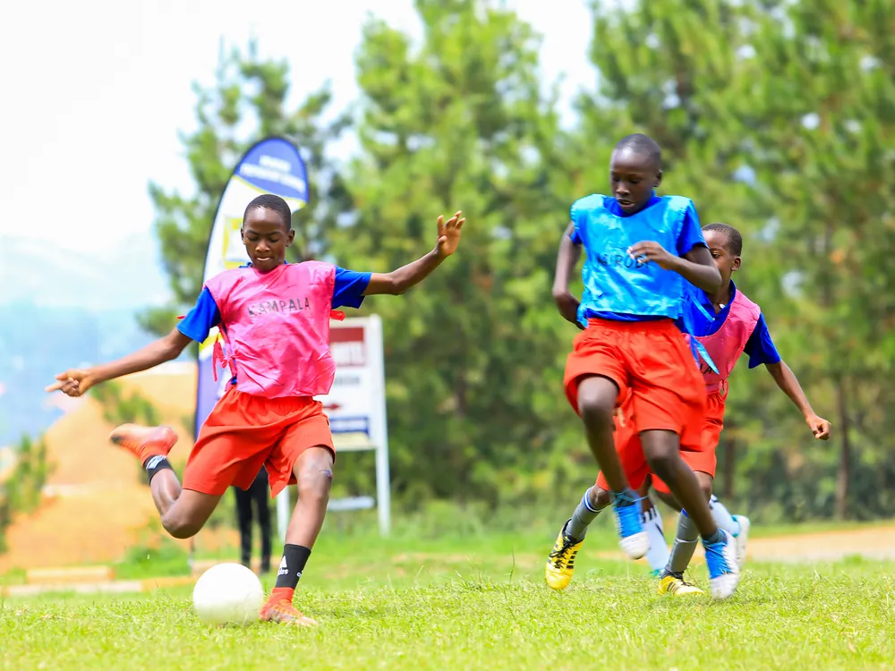 Pupils playing football on sports day