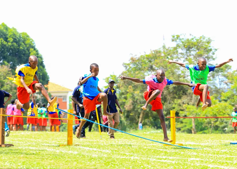 A pupil clearing the high jump on sports day